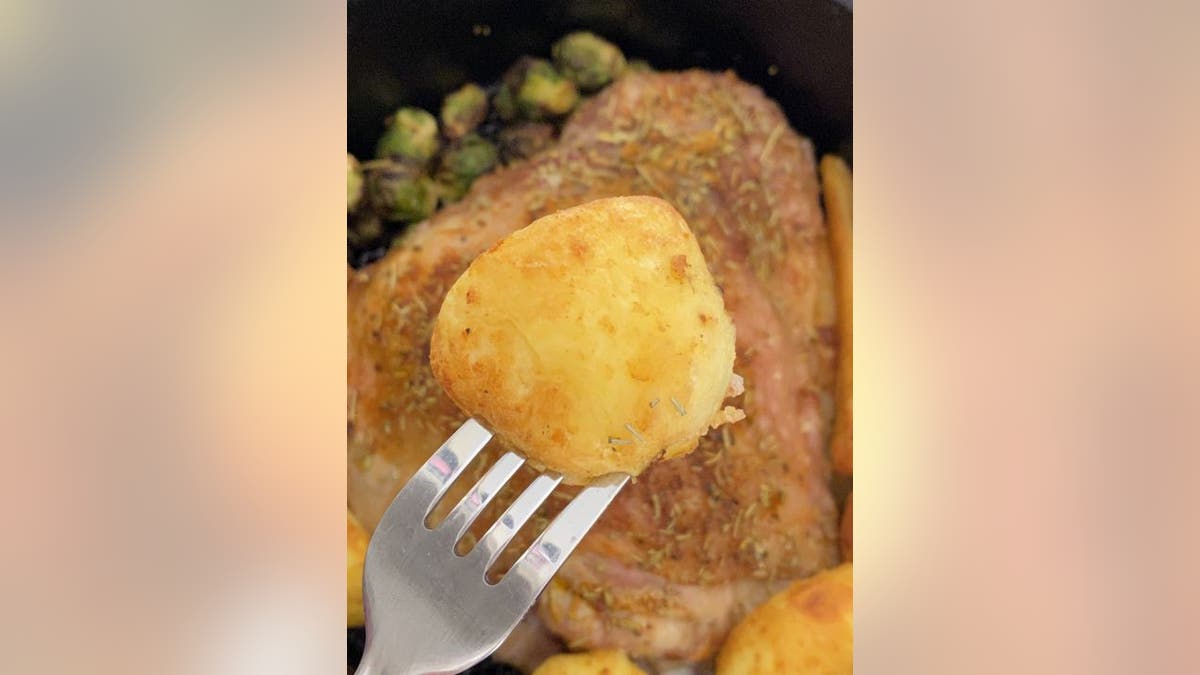 This air fryer turkey from Samantha Milner at RecipeThis.com is served with stuffing and roasted potatoes.
