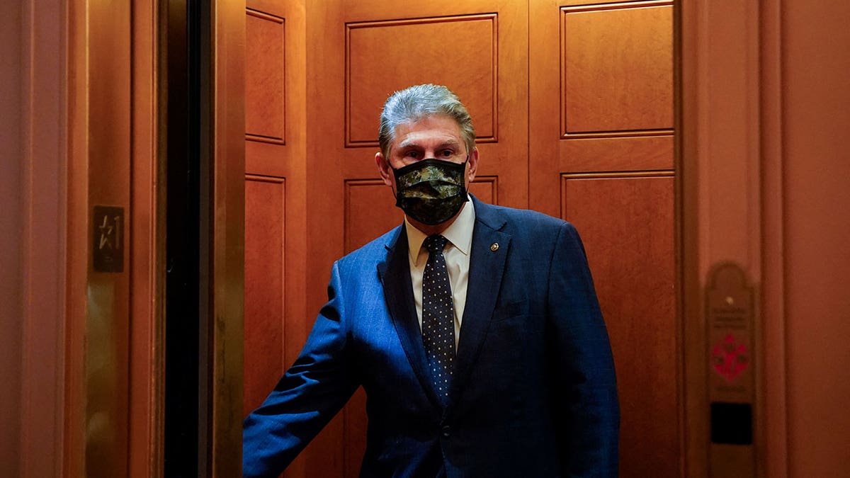 U.S. Sen. Joe Manchin, D, W.Va., closes the door of an elevator after a Democratic policy luncheon at the U.S. Capitol in Washington, D.C., Dec. 16, 2021.