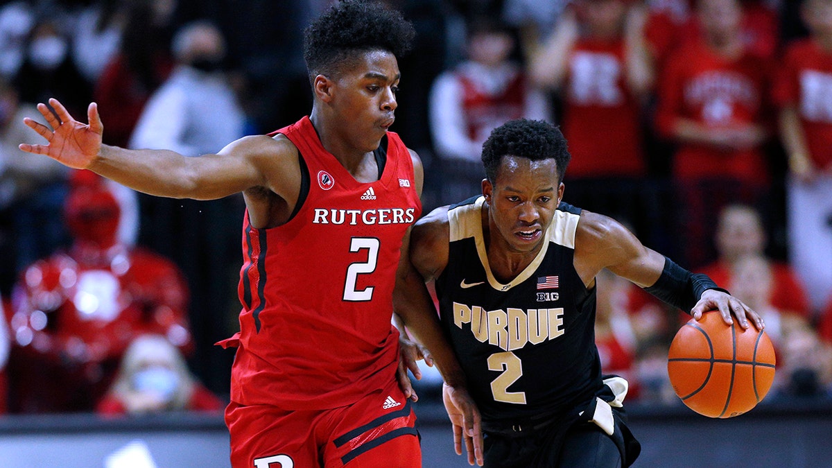Purdue guard Eric Hunter Jr. (2) drives to the basket against Rutgers guard Jalen Miller (2) during the first half of an NCAA college basketball game in Piscataway, N.J., Thursday, Dec. 9, 2021.