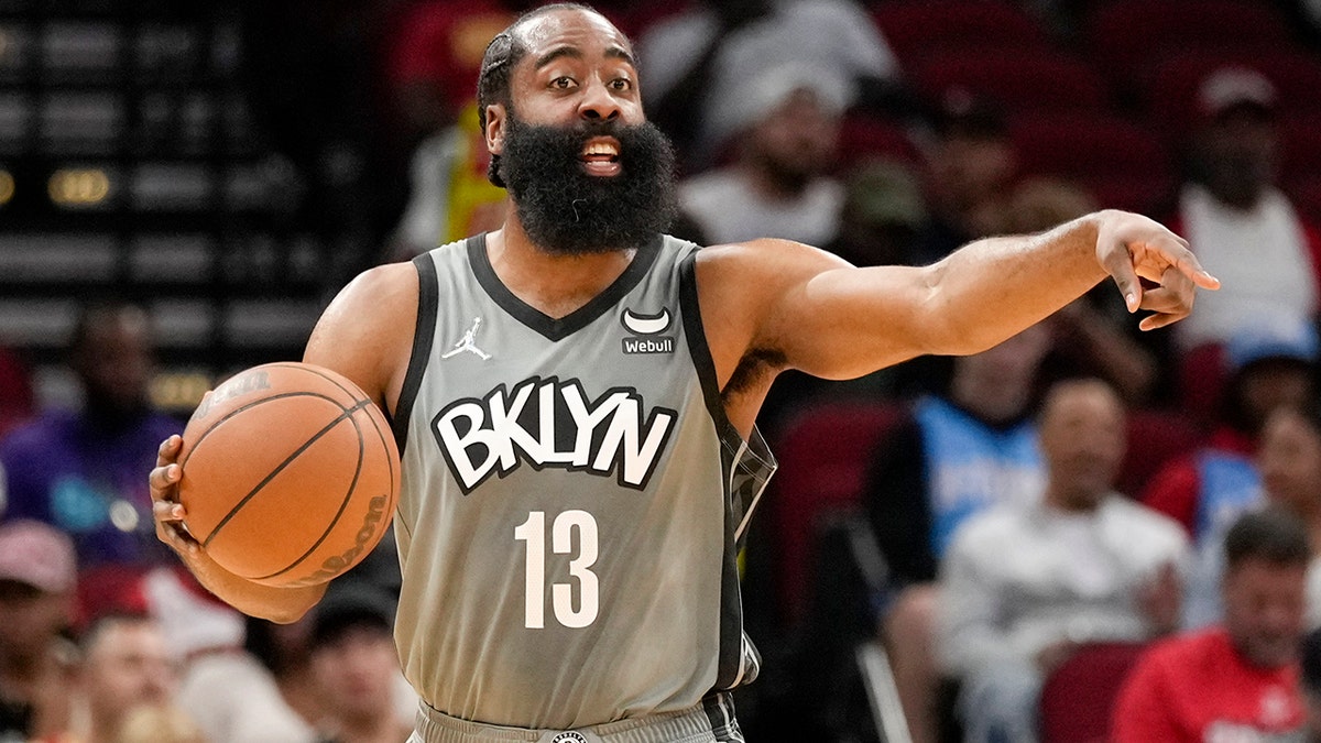 Brooklyn Nets guard James Harden gives instructions during the first half of an NBA basketball game against the Houston Rockets, Wednesday, Dec. 8, 2021, in Houston.
