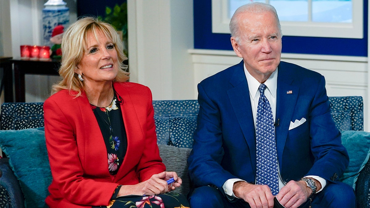President Biden and first lady Jill Biden speak with the NORAD Tracks Santa Operations Center on Peterson Air Force Base, Colo., via teleconference in the South Court Auditorium on the White House campus in Washington, Friday, Dec. 24, 2021. (AP Photo/Carolyn Kaster)