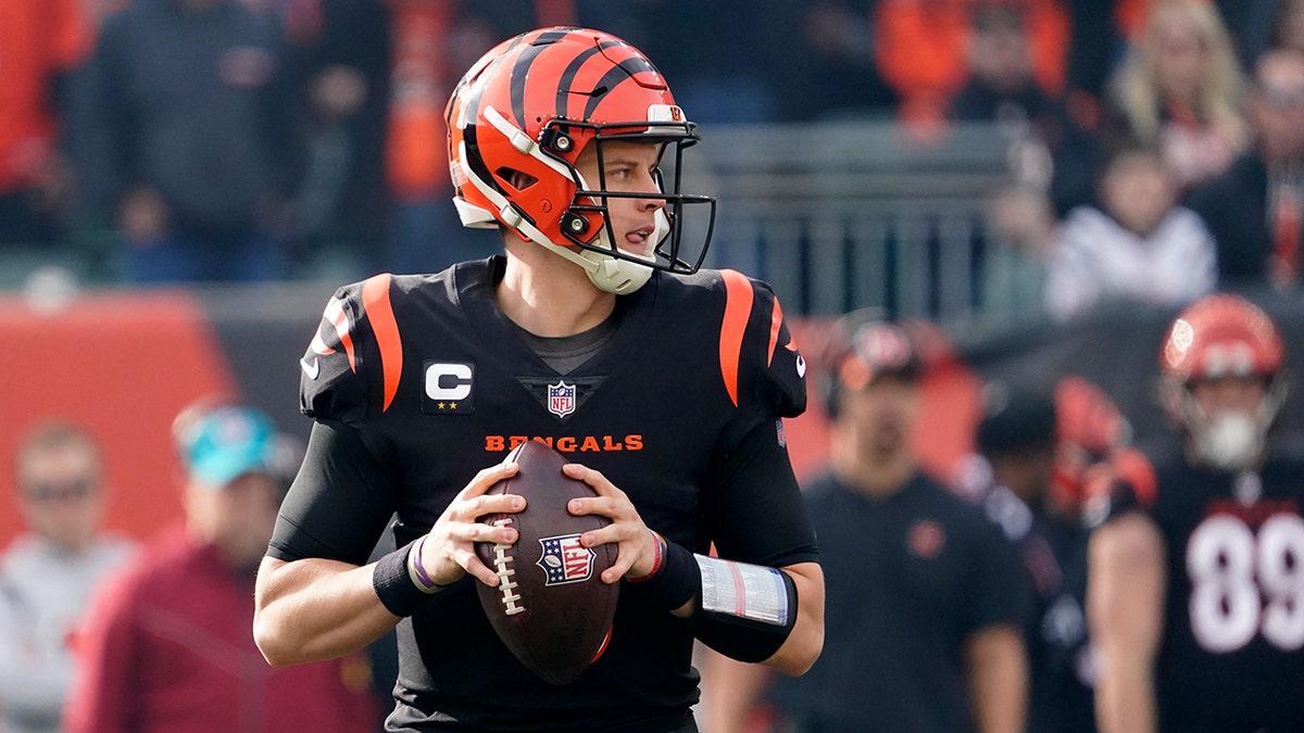 Cincinnati Bengals quarterback Joe Burrow looks to throw during the fist half of an NFL football game against the Baltimore Ravens, Sunday, Dec. 26, 2021, in Cincinnati.