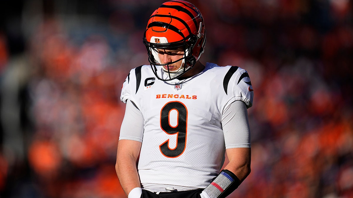 Cincinnati Bengals quarterback Joe Burrow (9) looks down after an incomplete pass against the Denver Broncos during the first half of an NFL football game, Sunday, Dec. 19, 2021, in Denver.