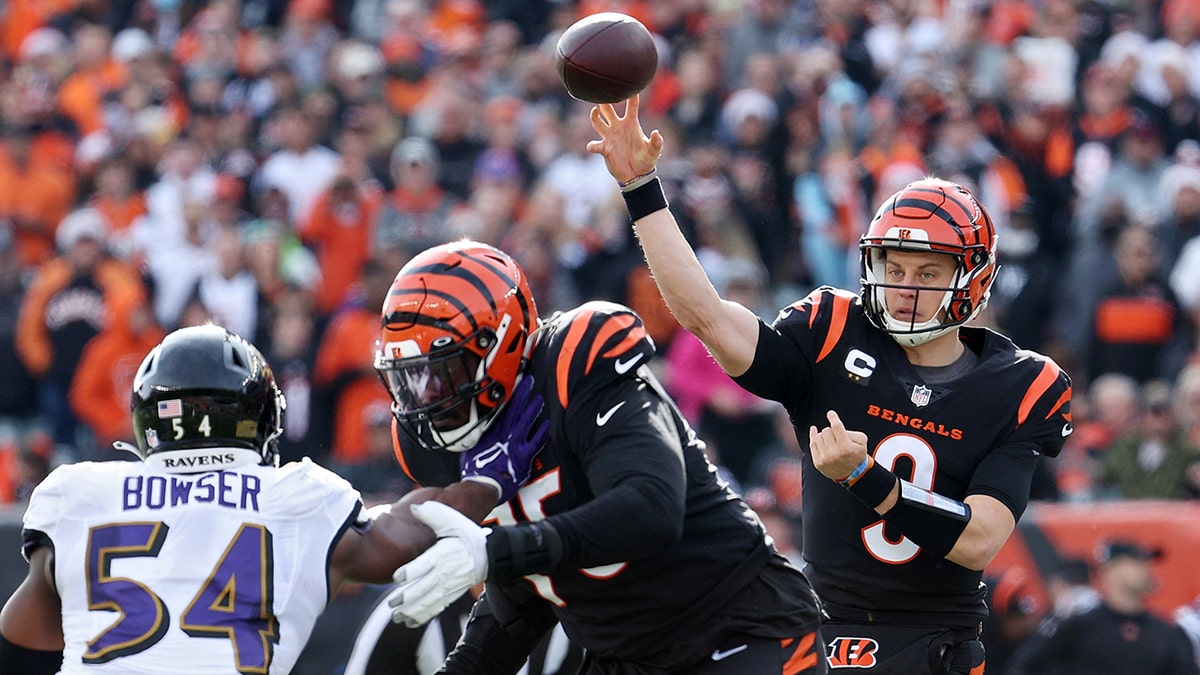 Joe Burrow #9 of the Cincinnati Bengals throws a pass during the first quarter in the game against the Baltimore Ravens at Paul Brown Stadium on December 26, 2021 in Cincinnati, Ohio.
