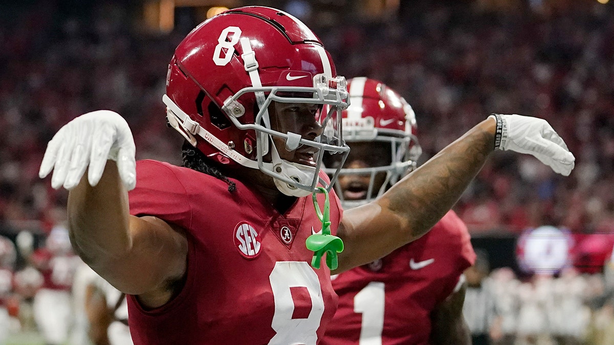 Alabama wide receiver John Metchie III celebrates his touchdown catch against Georgia during the Southeastern Conference championship on Saturday, Dec. 4, 2021, in Atlanta.