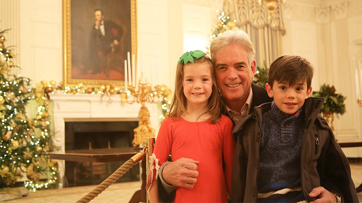John Roberts and his twin children at White House Christmas
