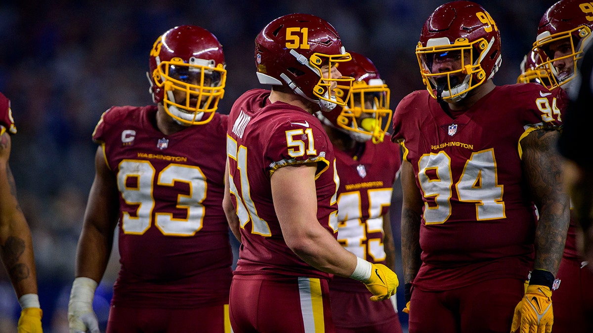 Washington Football Team outside linebacker David Mayo (51) sets the play with defensive tackle Jonathan Allen (93) and defensive tackle Daron Payne (94) during the game against the Dallas Cowboys at AT&amp;T Stadium.