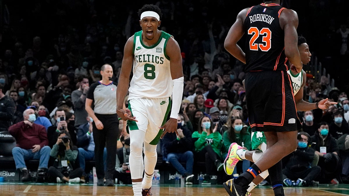 Boston Celtics guard Josh Richardson (8) celebrates after hitting a 3-point shot during the second half of an NBA basketball game against the New York Knicks, Saturday, Dec. 18, 2021, in Boston.