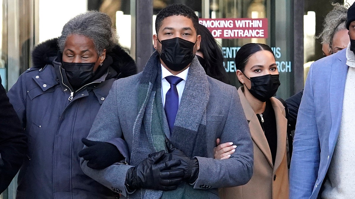 Actor Jussie Smollett, center, departs with his mother Janet, second from left, from the Leighton Criminal Courthouse, Wednesday, Dec. 8, 2021, in Chicago, after Cook County Judge James Linn gave the case to jury. (AP Photo/Nam Y. Huh)