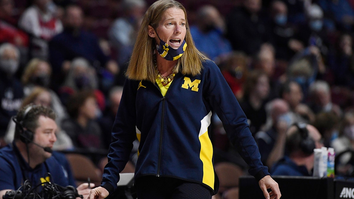 Michigan head coach Kim Barnes Arico calls out to her team in the second half of an NCAA college basketball game against Baylor, Sunday, Dec. 19, 2021, in Uncasville, Conn.