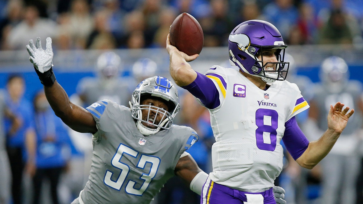 Detroit Lions outside linebacker Charles Harris (53) pressures Minnesota Vikings quarterback Kirk Cousins (8) during the first half Sunday, Dec. 5, 2021, in Detroit.