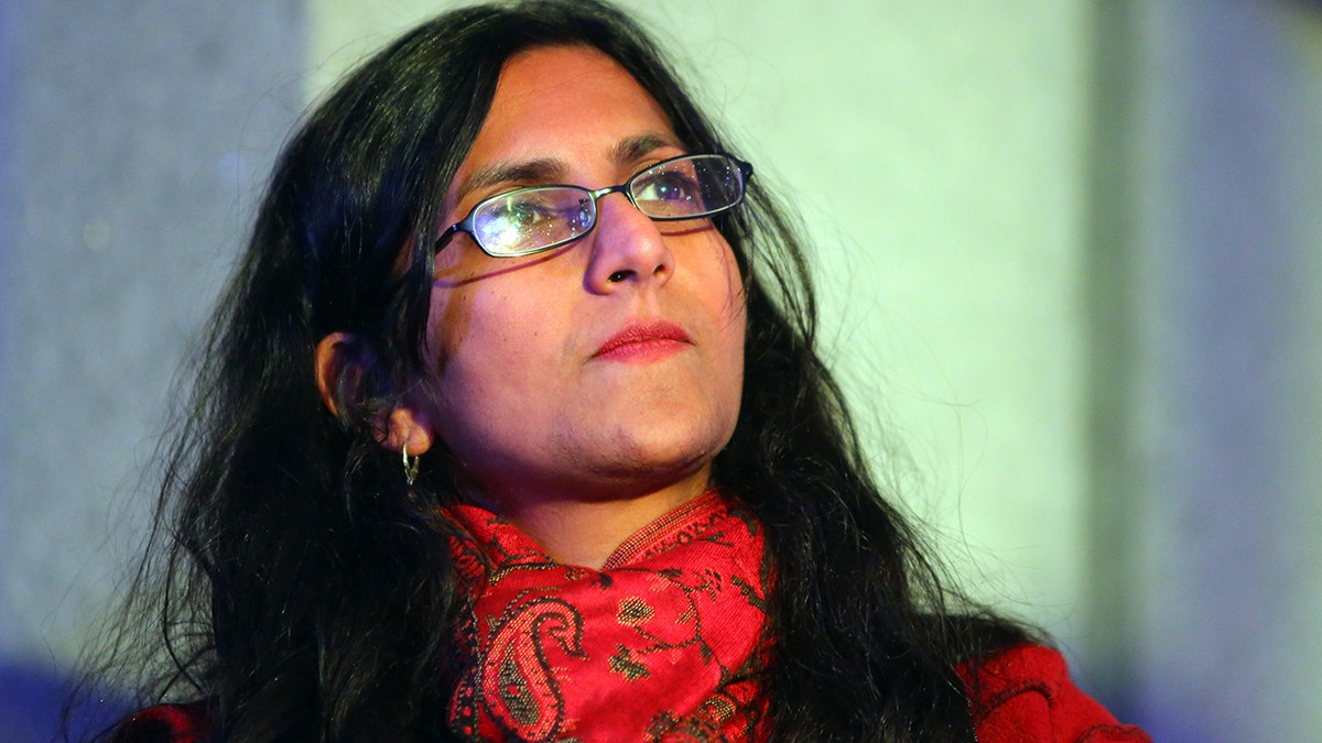 Seattle city council member Kshama Sawant listens to speakers during a rally for women's rights on International Women's Day, Wednesday, March 8, 2017, at Westlake Park.