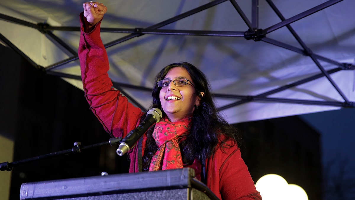 Seattle Council member Kshama Sawant speaks during an International Women's Day rally in Seattle, Washington on March 8, 2017.  Throngs of demonstrators, mostly women and many wearing red, rallied in New York and Washington to protest against President Donald Trump's policies toward women on International Women's Day. 