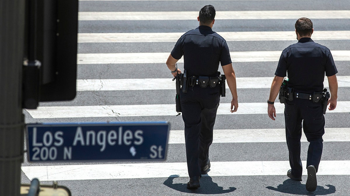 Los Angeles police walking on street