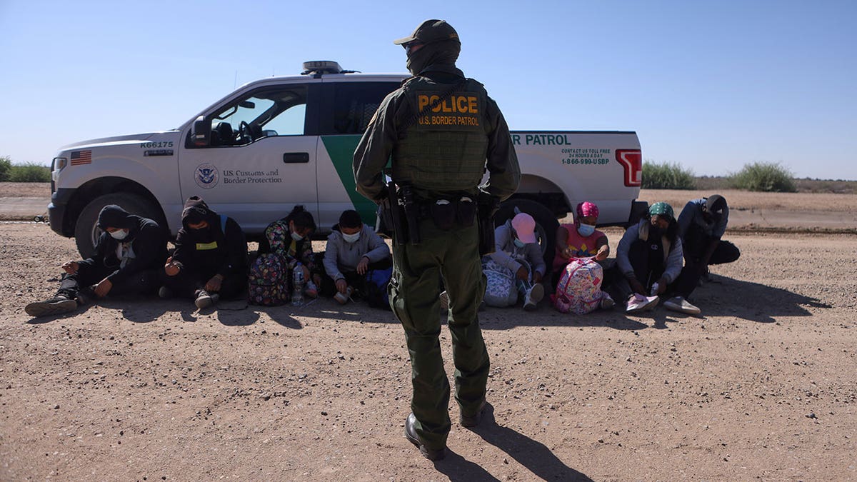 A group of asylum seekers from Mexico, Cuba and Haiti are detained by U.S. Border Patrol in San Luis, Arizona, April 19, 2021.