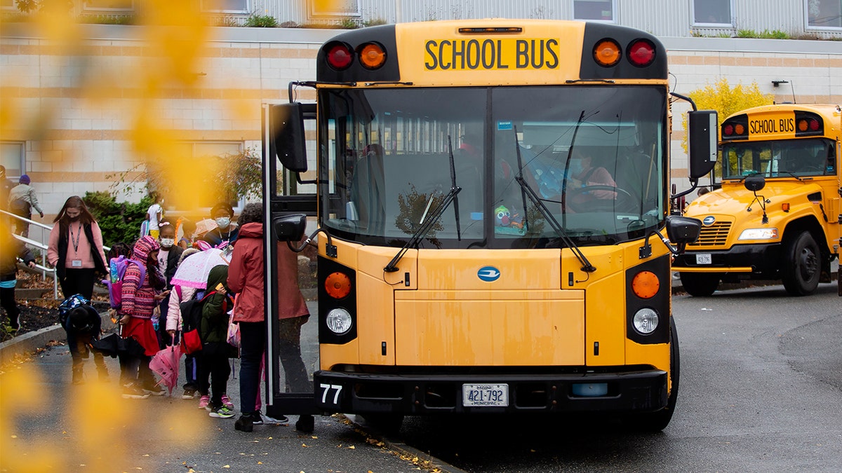 Students at East End Community School in Portland, Maine, board bus