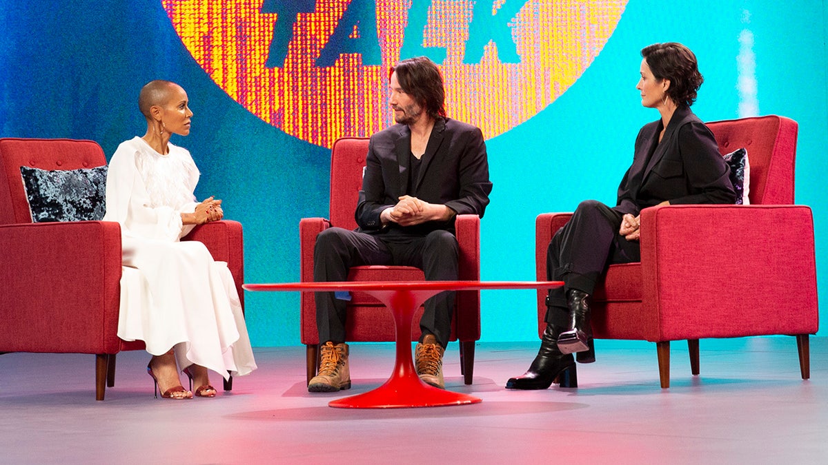 Keanu Reeves (center) revealed during an episode of Facebook Watch's "Red Table Talk" that he'd choose to live as Neo, his "Matrix" character, over living as John Wick in real life.