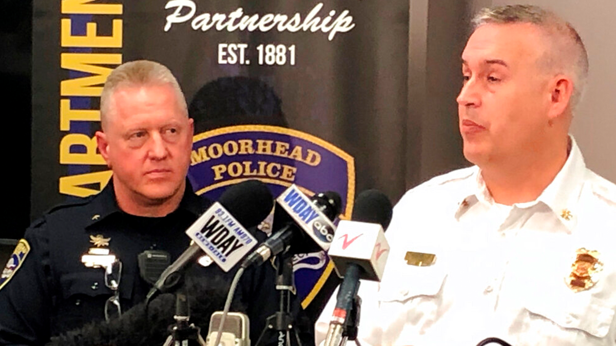 Moorhead, Minn., Police Chief Shannon Monroe, left, and acting Fire Chief Jeff Wallin appear at a news conference on Wednesday, Dec. 22, 2021, to talk about the deaths of seven residents who died from carbon monoxide poisoning.