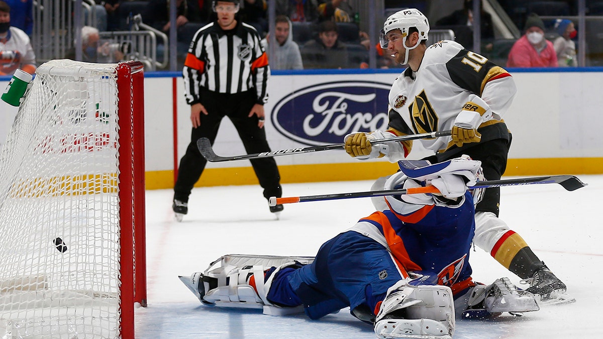 Vegas Golden Knights' Nicolas Roy (10) scores the winning penalty shot past New York Islanders' goalie Ilya Sorokin during an NHL hockey game Sunday, Dec. 19, 2021, in Elmont, N.Y.