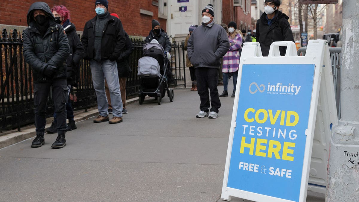 People queue for a COVID-19 test as the omicron coronavirus variant continues to spread in Manhattan, New York City, Dec. 21, 2021.