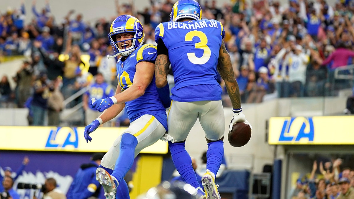 Los Angeles Rams wide receiver Odell Beckham Jr. (3) celebrates his touchdown catch with Cooper Kupp during the second half of an NFL football game against the Jacksonville Jaguars Sunday, Dec. 5, 2021, in Inglewood, California.
