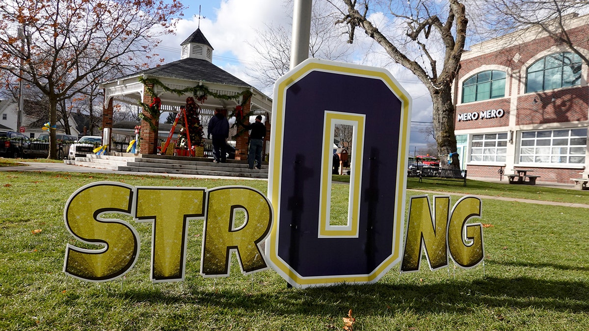 A sign in Centennial Park shows support for the students and staff killed and wounded in the November 30 shooting at Oxford High School on December 2, 2021 in Oxford, Michigan. 