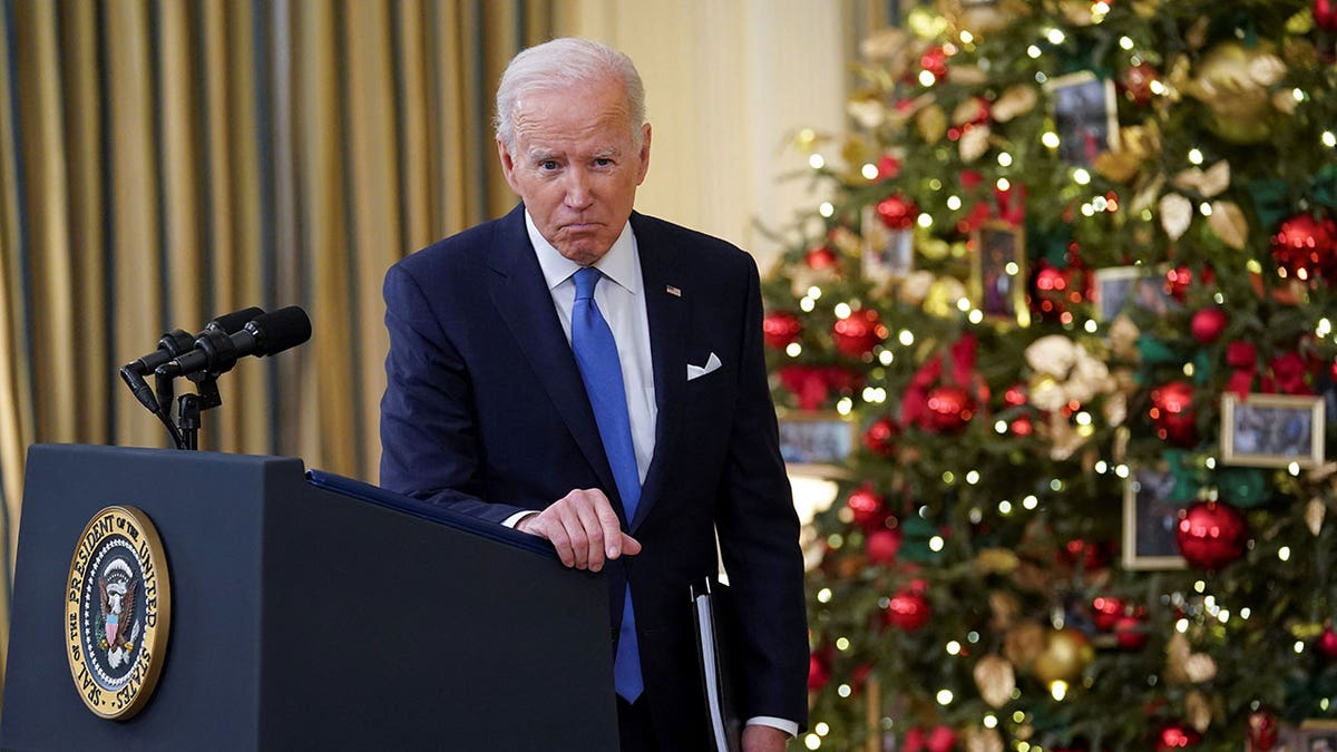 U.S. President Joe Biden listens to a question as he speaks about the country's fight against the coronavirus disease (COVID-19) at the White House in Washington, U.S., December 21, 2021. REUTERS/Kevin Lamarque