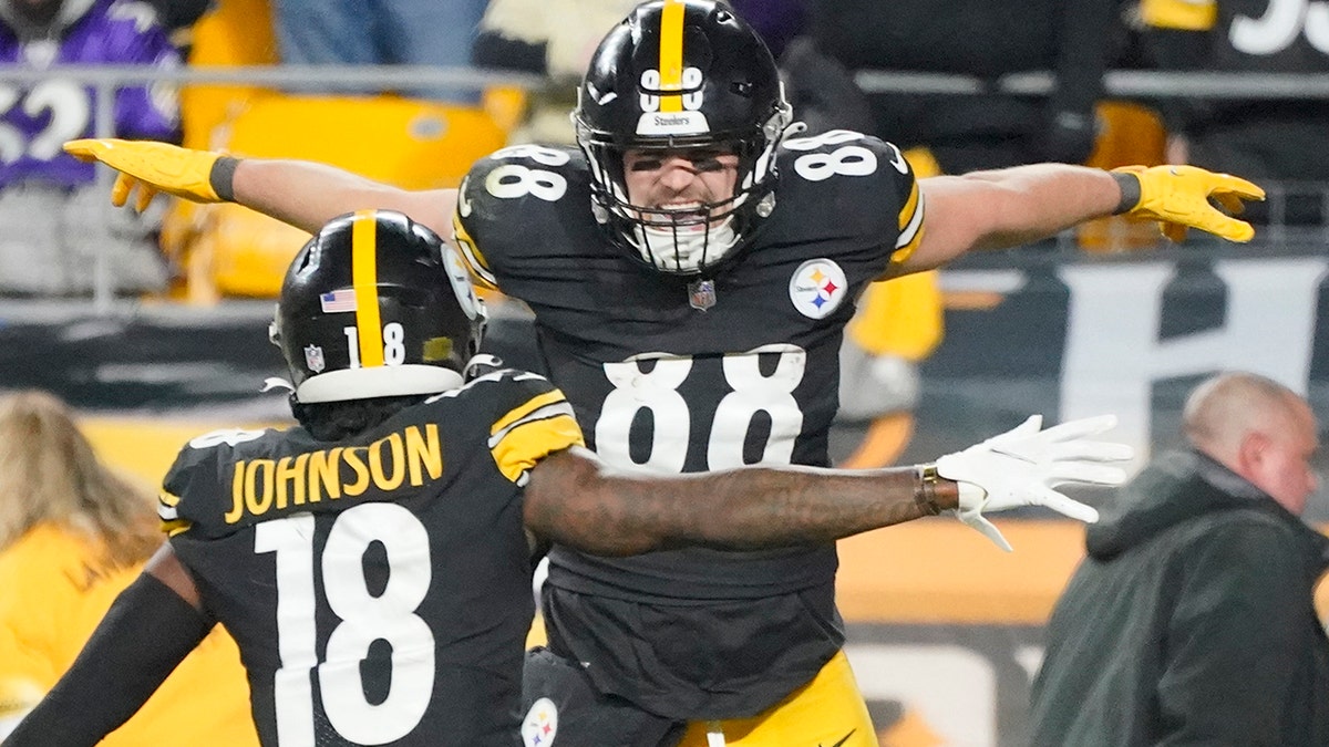 Pittsburgh Steelers tight end Pat Freiermuth (88) celebrates with wide receiver Diontae Johnson (18) after making a catch for a two-point conversion against the Baltimore Ravens during the second half of an NFL football game, Sunday, Dec. 5, 2021, in Pittsburgh.