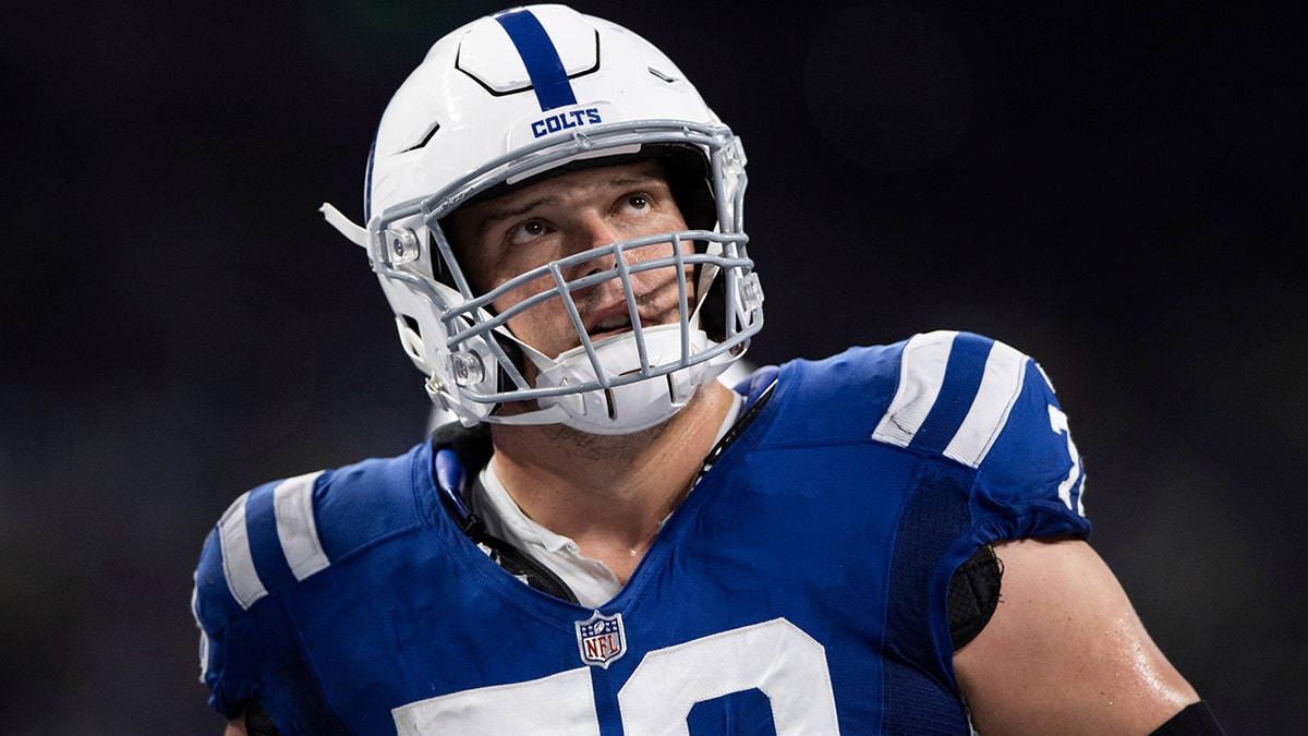 FILE - Indianapolis Colts center Ryan Kelly watches a replay during the team's NFL football game against the Jacksonville Jaguars on Nov. 14, 2021, in Indianapolis.