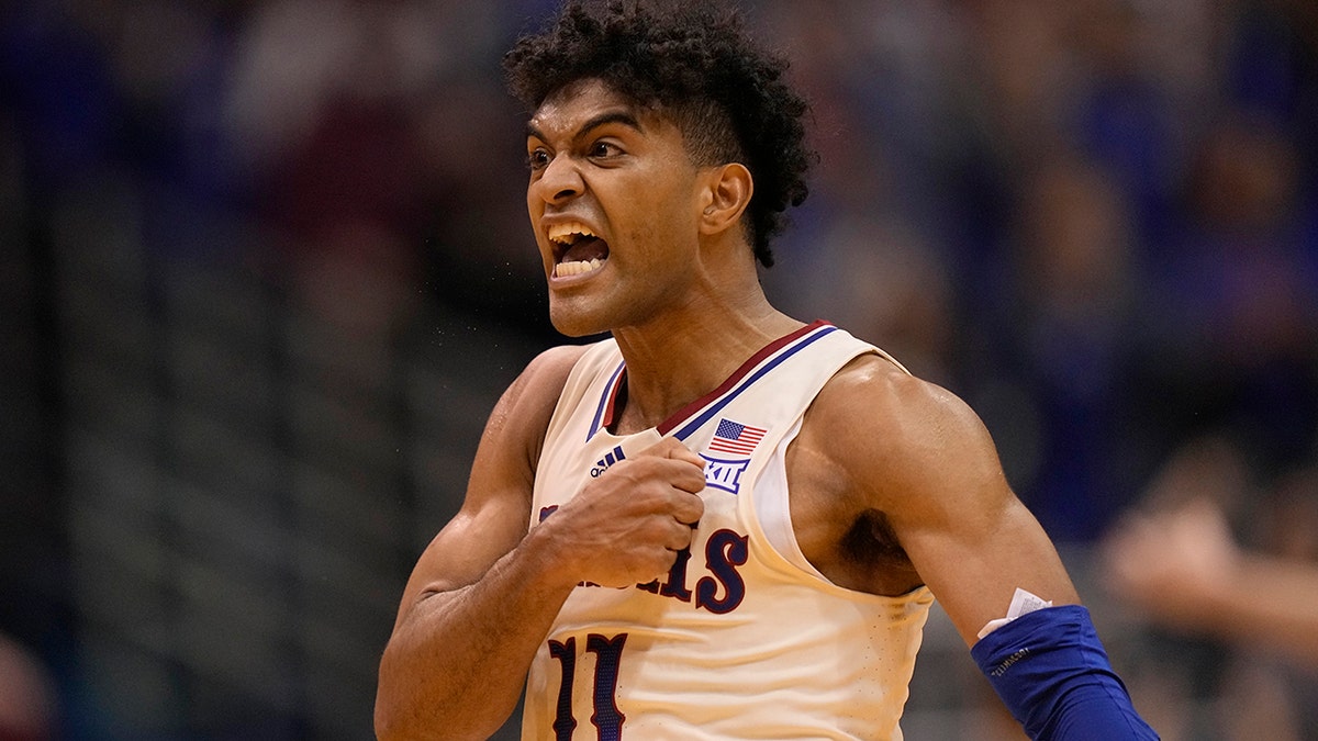 Kansas' Remy Martin celebrates after making a basket during the second half of an NCAA college basketball game against Stephen F. Austin Saturday, Dec. 18, 2021, in Lawrence, Kan.