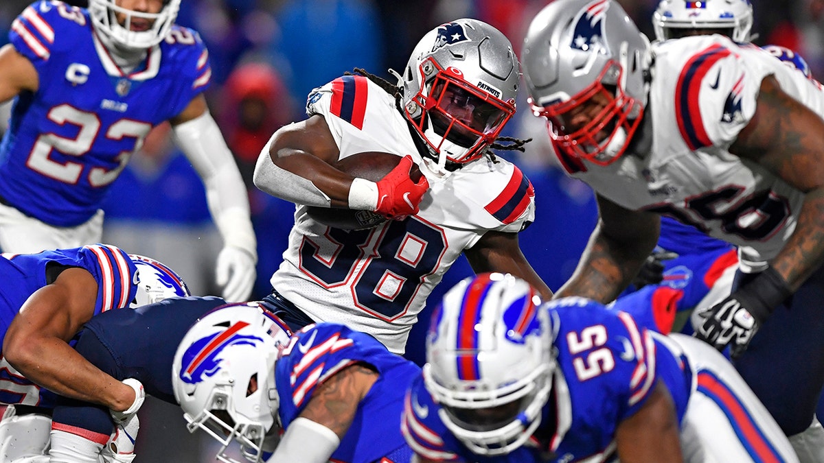 New England Patriots running back Rhamondre Stevenson (38) carries the ball during the second half of an NFL football game against the Buffalo Bills in Orchard Park, New York, Monday, Dec. 6, 2021.
