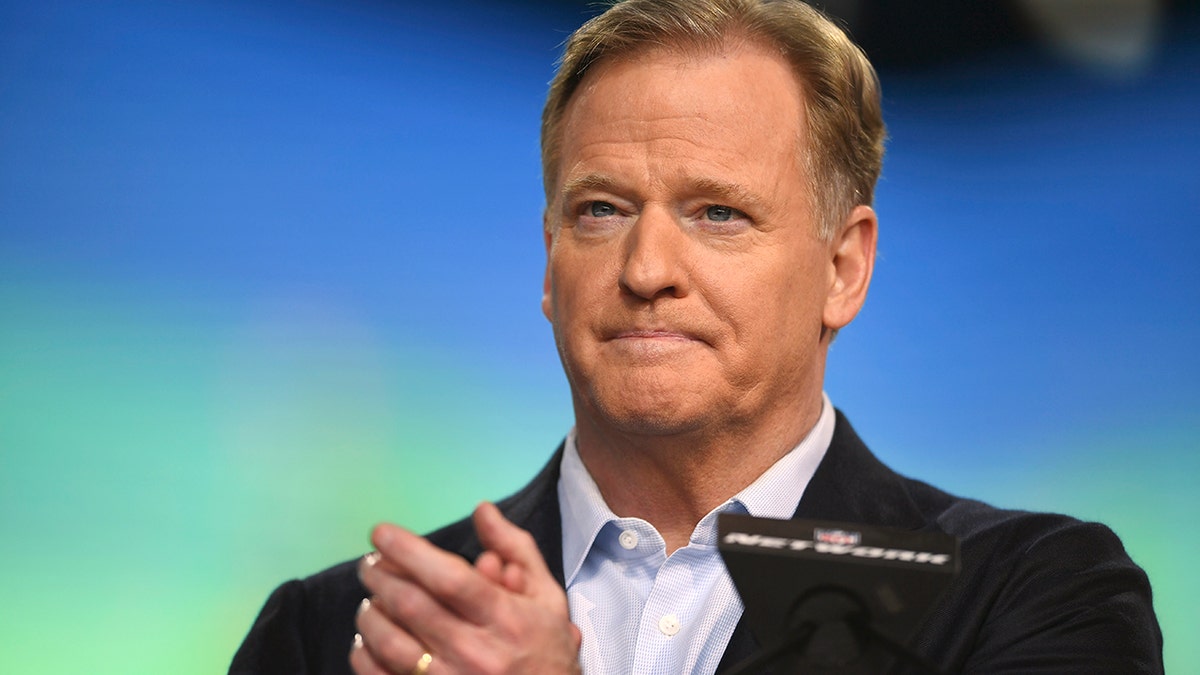 FILE - NFL Commissioner Roger Goodell announces the start of the second round of the NFL football draft, Friday, April 30, 2021, in Cleveland. Only unvaccinated players and those experiencing possible symptoms of COVID-19 will be tested, starting Sunday, Dec. 19, under the NFL’s revised protocols
