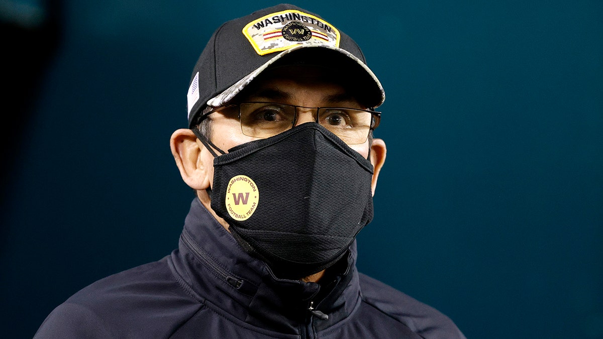 Head coach Ron Rivera of the Washington Football Team looks on during pregame warm-ups prior to a game against the Philadelphia Eagles at Lincoln Financial Field on December 21, 2021 in Philadelphia, Pennsylvania.