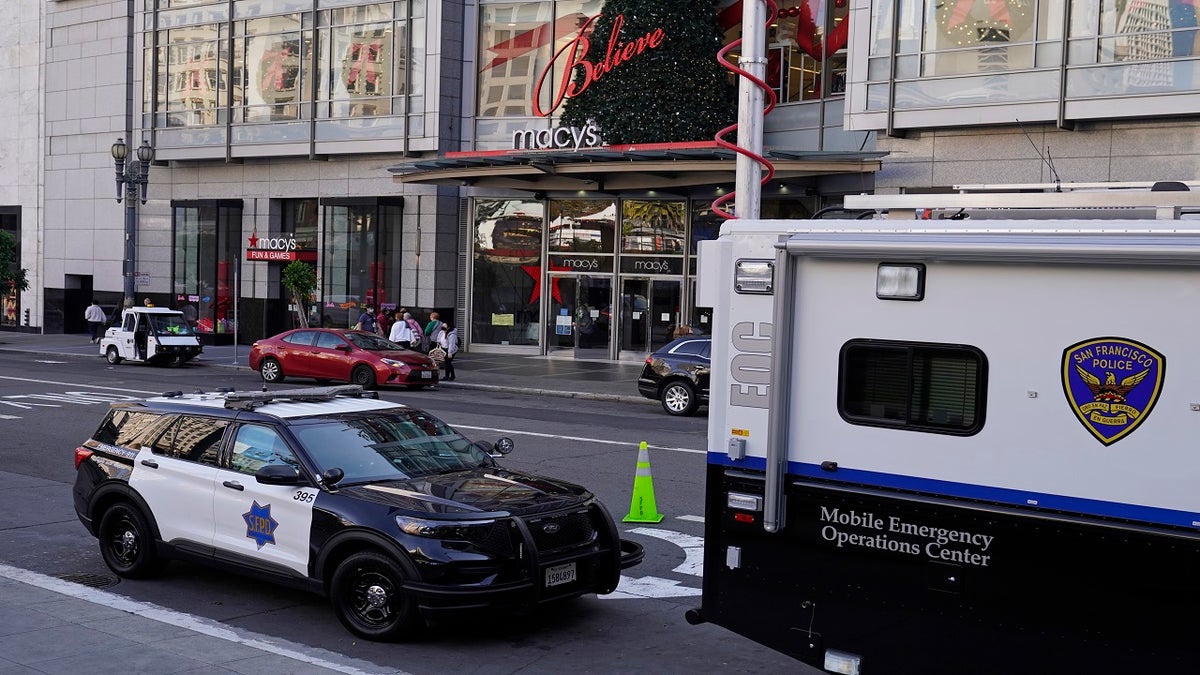 Police vehicles are stationed at Union Square following recent robberies in San Francisco on Dec. 2, 2021. 