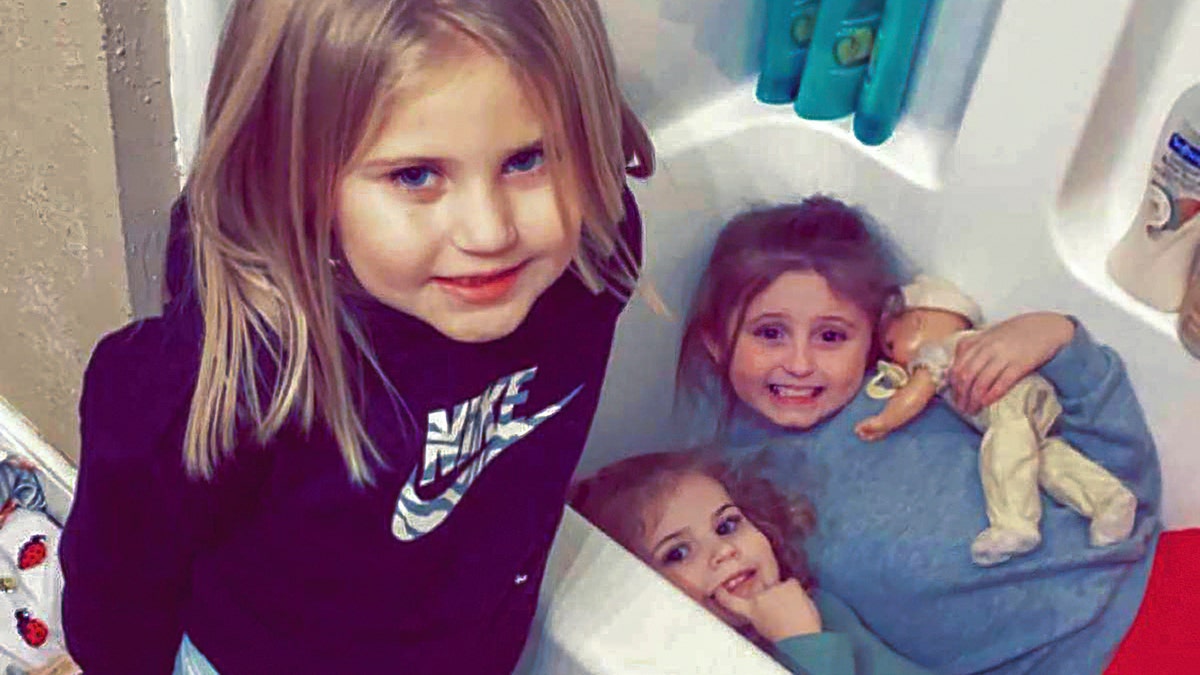 In this photo provided by Sandra Hooker, from left, Avalinn Rackley, 7, Alanna Rackley, 3, and Annistyn Rackley, 9, pose for a picture in a bathroom in their home near Caruthersville, Missouri. Annistyn, a third-grader who loved swimming, dancing and cheerleading, was among dozens of people who died because of the severe storm on Friday.