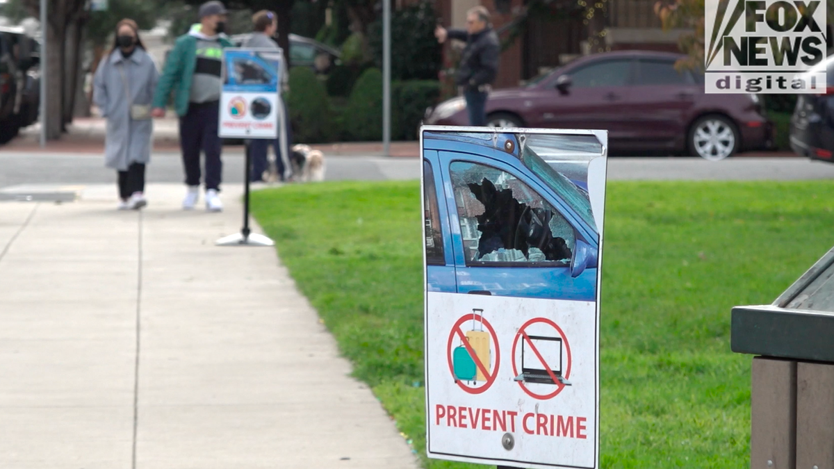 A sign warns residents to take valuables out of their car