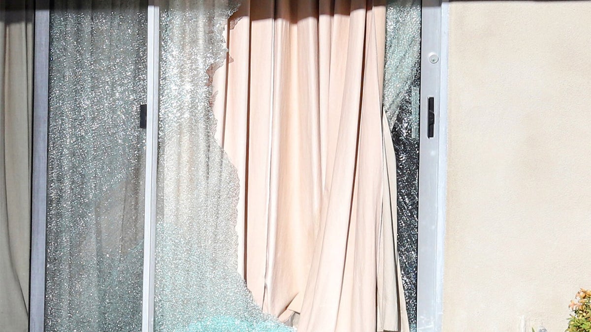 A broken window at the home of Clarence Avant wife's murder Dec. 1, 2021 (APEX / MEGA TheMegaAgency.com)