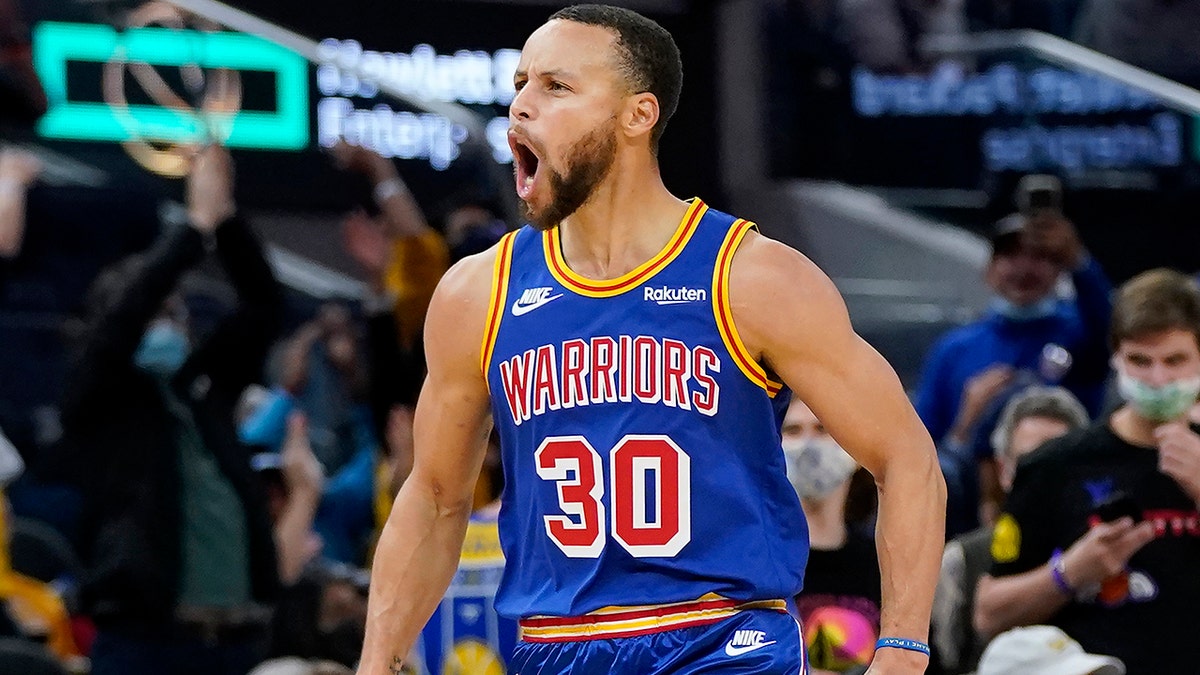 Golden State Warriors guard Stephen Curry (30) celebrates after shooting a 3-point basket against the Memphis Grizzlies during the second half of an NBA basketball game in San Francisco, Thursday, Dec. 23, 2021.
