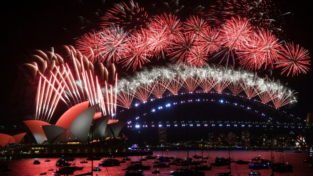 Fireworks explode over the Sydney Opera House and Harbour Bridge during New Year’s Eve celebrations in Sydney, Saturday, Jan. 1, 2022. 