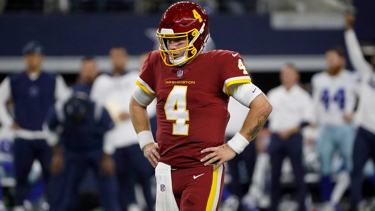 Washington Football Team quarterback Taylor Heinicke (4) stands on the field between plays in the second half of an NFL football game against the Dallas Cowboys in Arlington, Texas, Sunday, Dec. 26, 2021.