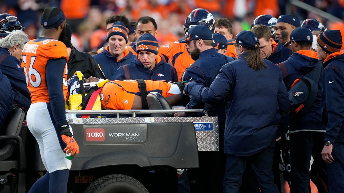 Denver Broncos quarterback Teddy Bridgewater is placed on a cart after being injured against the Cincinnati Bengals during the second half of an NFL football game, Sunday, Dec. 19, 2021, in Denver.?