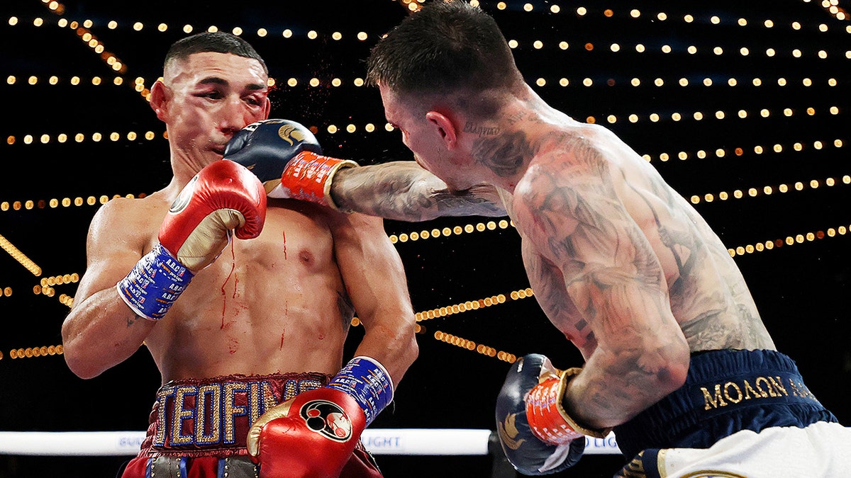 George Kambosos punches Teófimo López during their championship bout for Lopez’s undisputed lightweight title at The Hulu Theater at Madison Square Garden Nov. 27, 2021 in New York, New York.