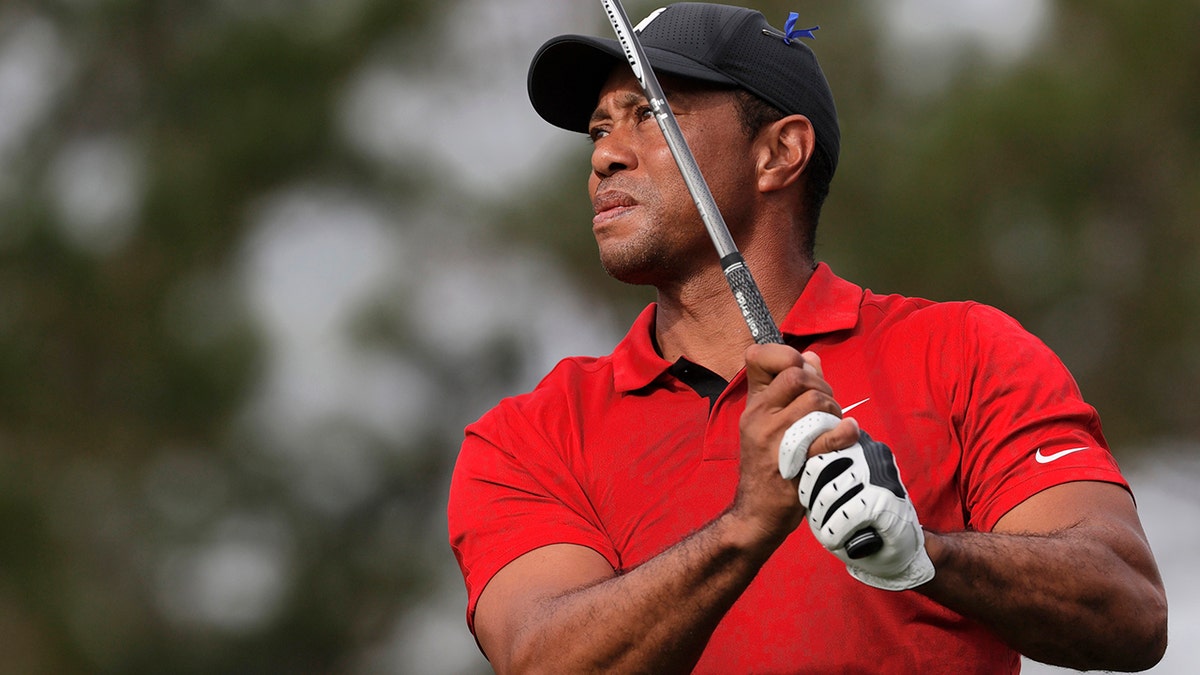 Tiger Woods tees off on the second hole during the second round of the PNC Championship golf tournament Sunday, Dec. 19, 2021, in Orlando, Florida.