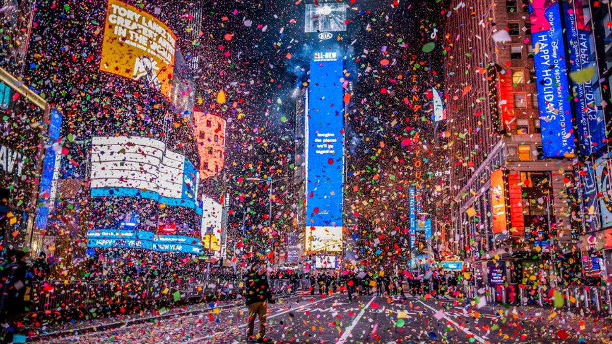 Confetti flies after the Times Square New Year's Eve Ball drops in a nearly empty Times Square due to the COVID-19 lockdown, early Friday, Jan. 1, 2021.