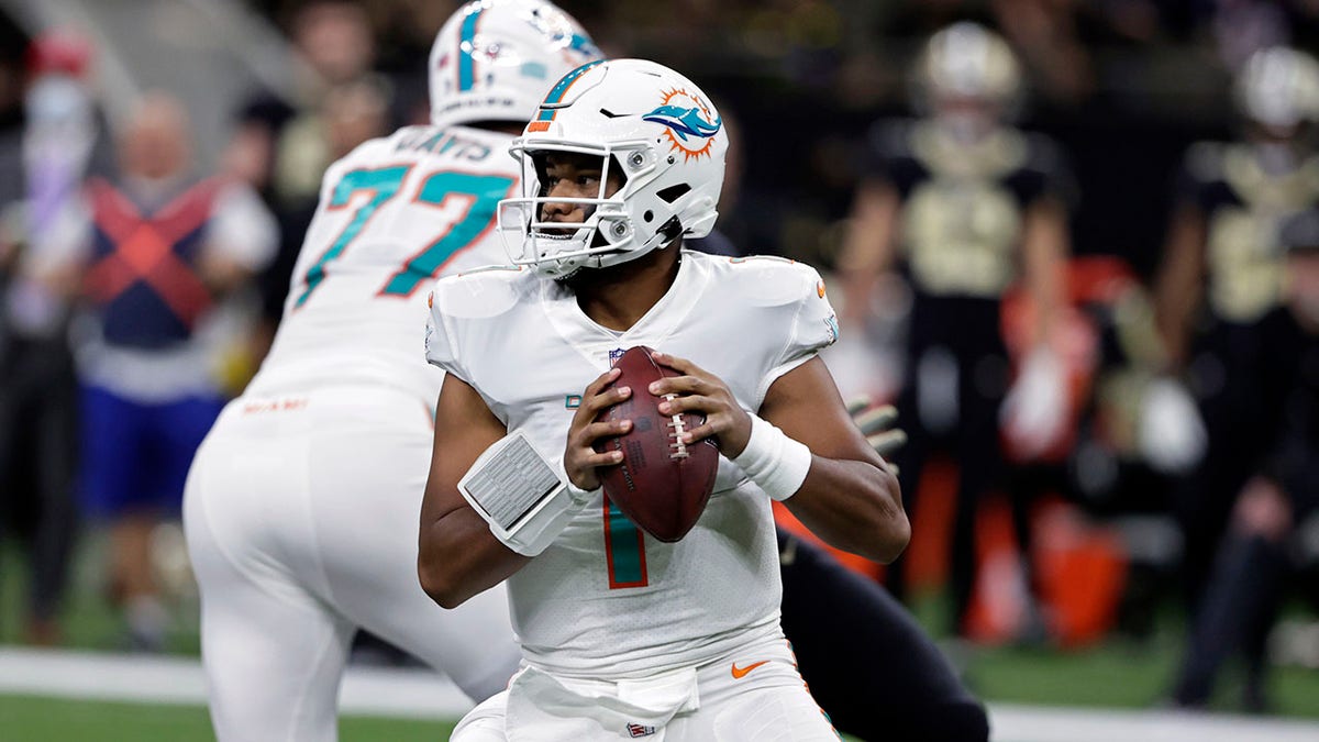 Miami Dolphins quarterback Tua Tagovailoa (1) throws a pass against the New Orleans Saints during the first half of an NFL football game Monday, Dec. 27, 2021, in New Orleans.