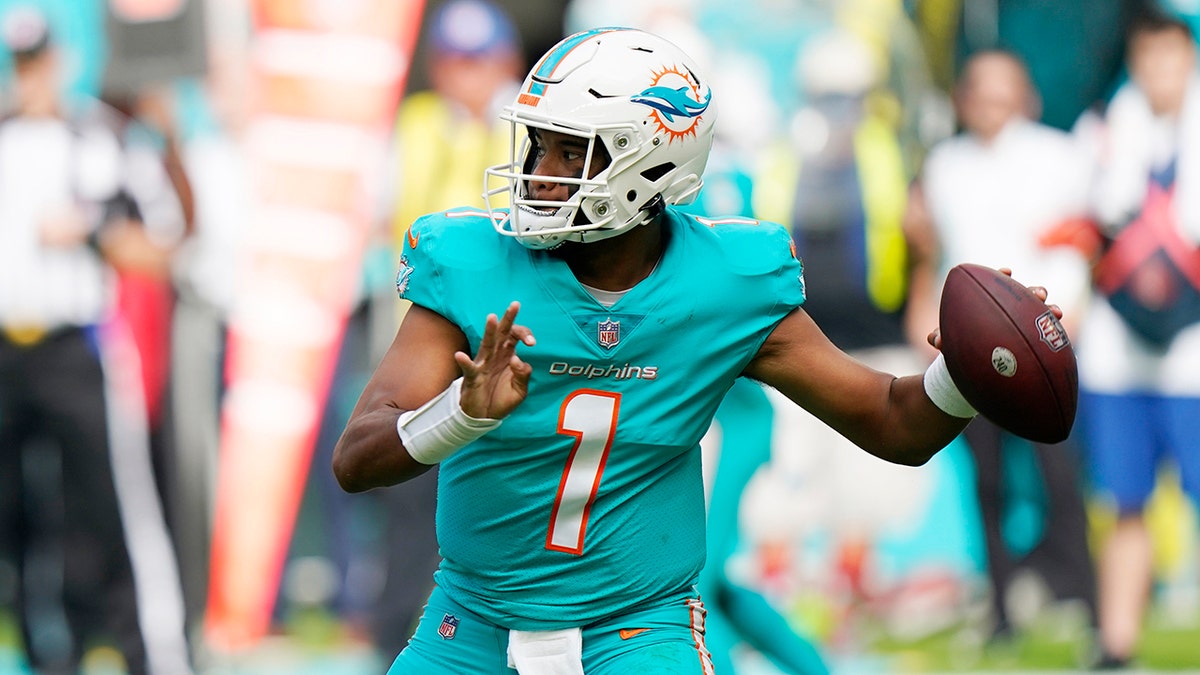 Miami Dolphins quarterback Tua Tagovailoa (1) aims a pass during the first half of an NFL football game against the New York Jets, Sunday, Dec. 19, 2021, in Miami Gardens, Fla.