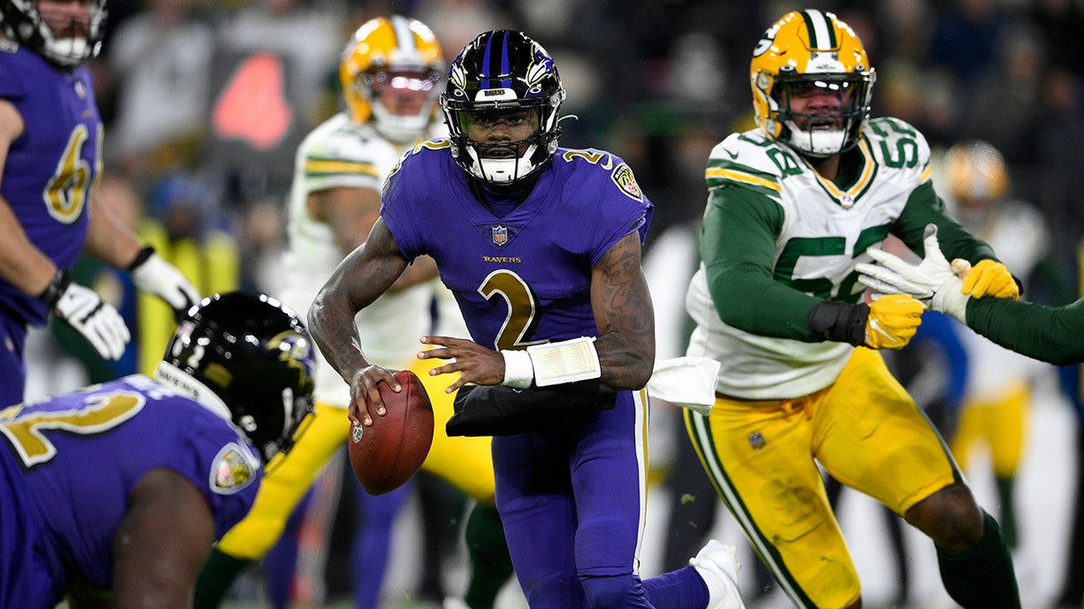 Baltimore Ravens quarterback Tyler Huntley (2) rushes the ball in the second half of an NFL football game against the Green Bay Packers, Sunday, Dec. 19, 2021, in Baltimore.