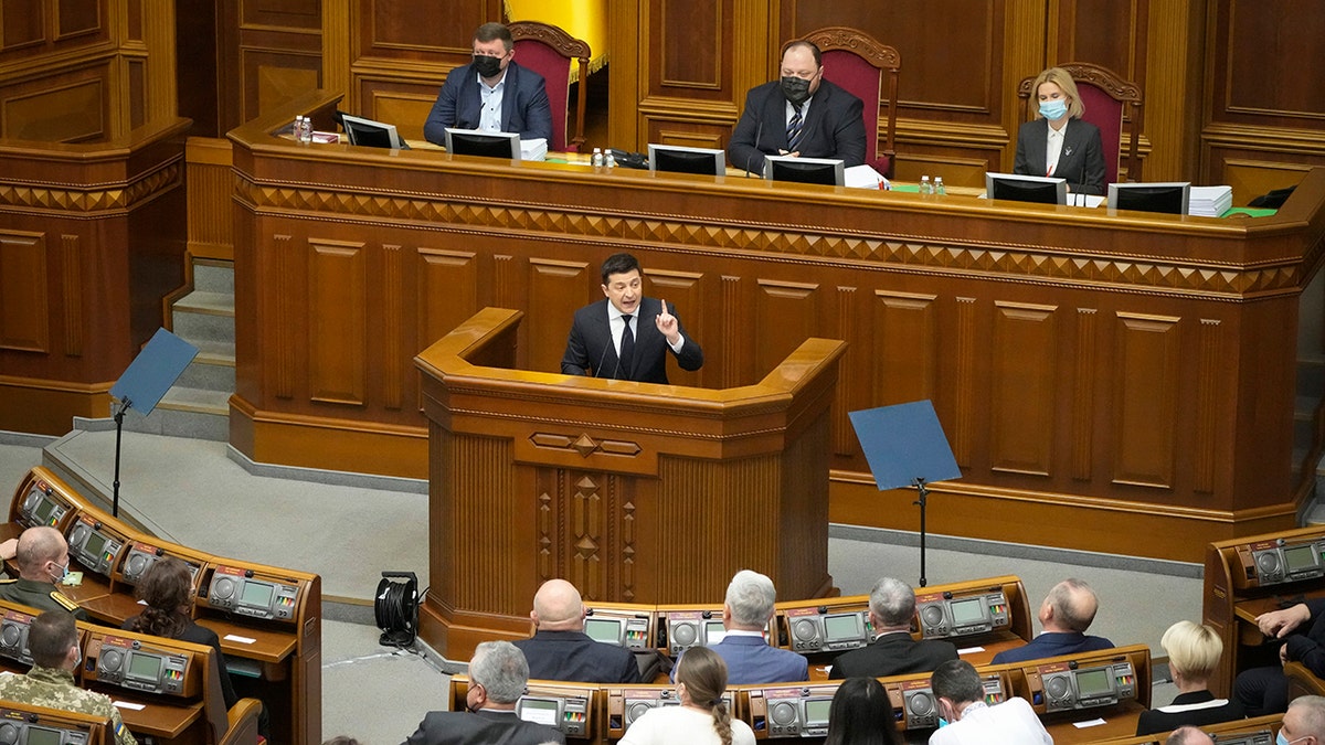 Ukrainian President Volodymyr Zelenskyy addresses lawmakers in Kyiv, Ukraine, Wednesday, Dec.1, 2021.