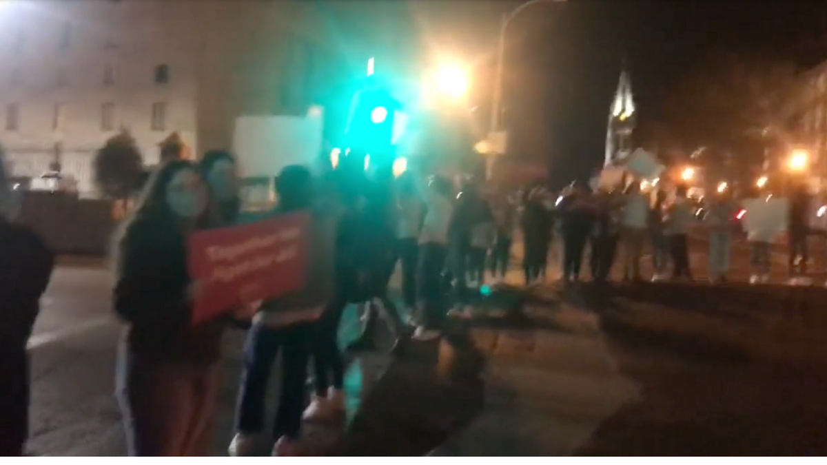 Protesters at Matt Walsh Event in St. Louis blocking intersection.