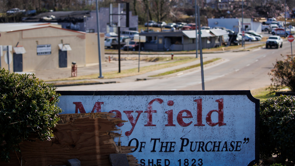MAYFIELD, KY - DECEMBER 11: A sign for the town of Mayfield, Kentucky stands amidst tornado damage on December 11, 2021, in Mayfield, Kentucky. Multiple tornadoes tore through parts of the lower Midwest late on Friday night leaving a large path of destruction and multiple fatalities.